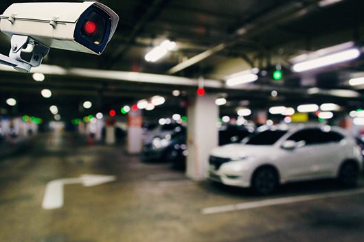 Image of a parking garage with a security camera